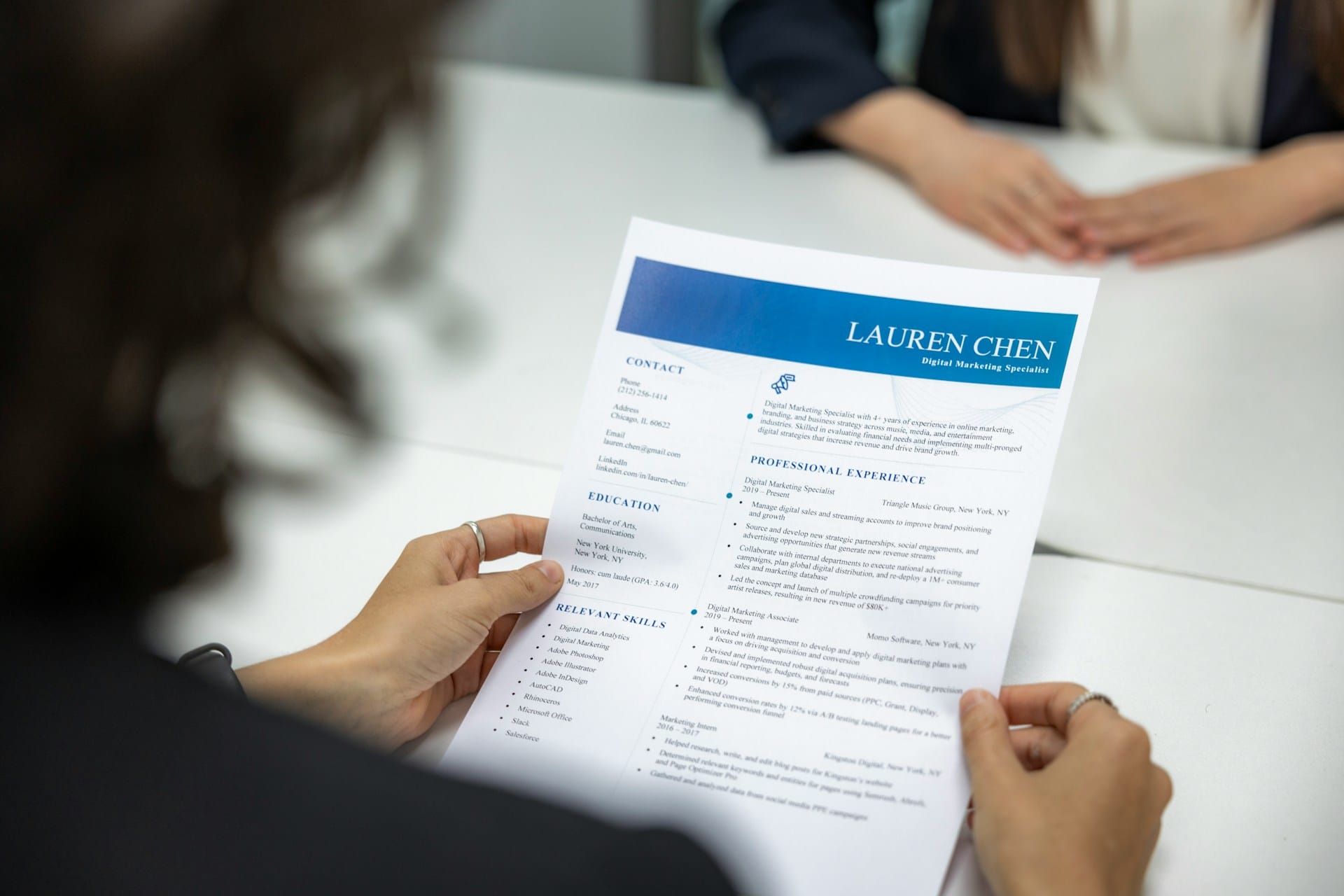 A recruiter holding CV